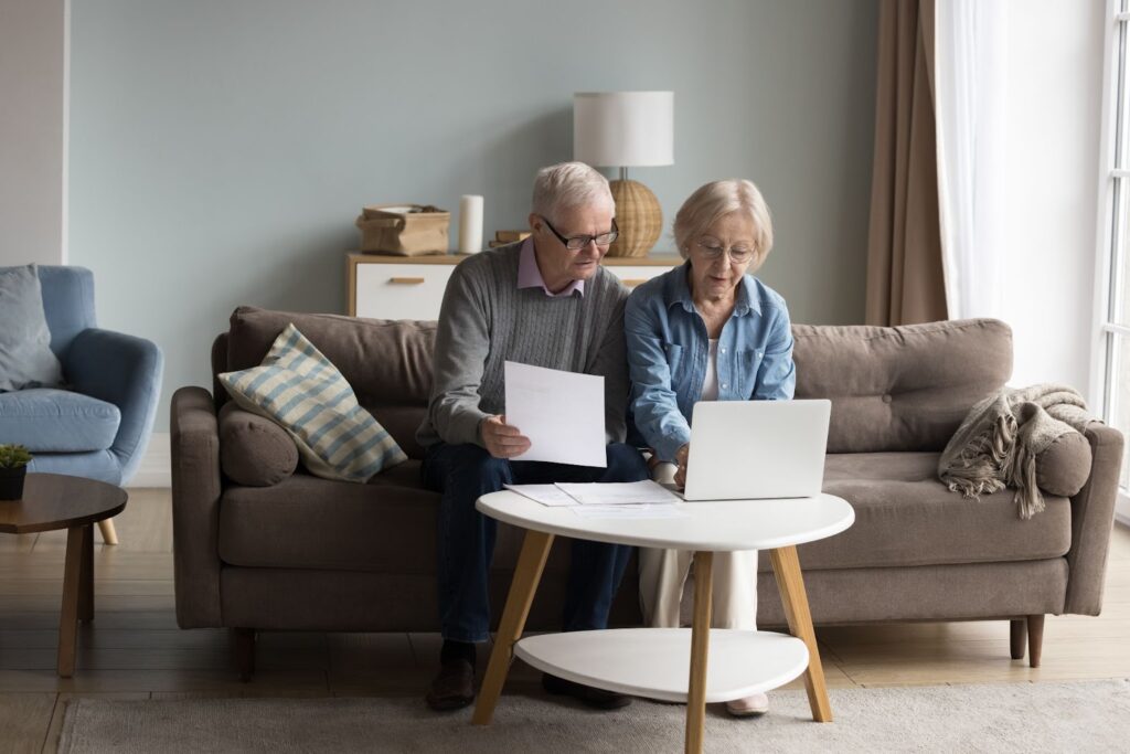 Senior man and woman evaluating their financials.