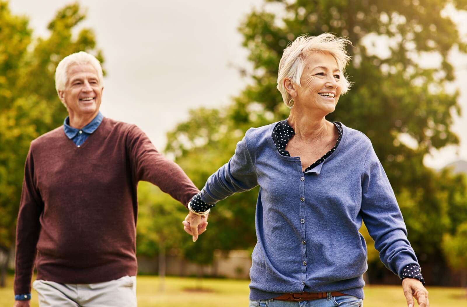 a senior couple walking together as a low-impact exercise